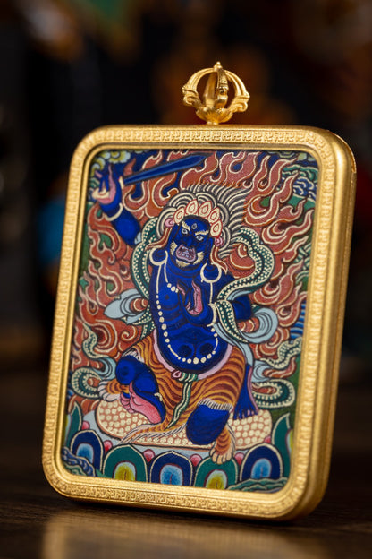 AURESTAR Acalanatha thangka pendant close-up with a gold-tone copper case.