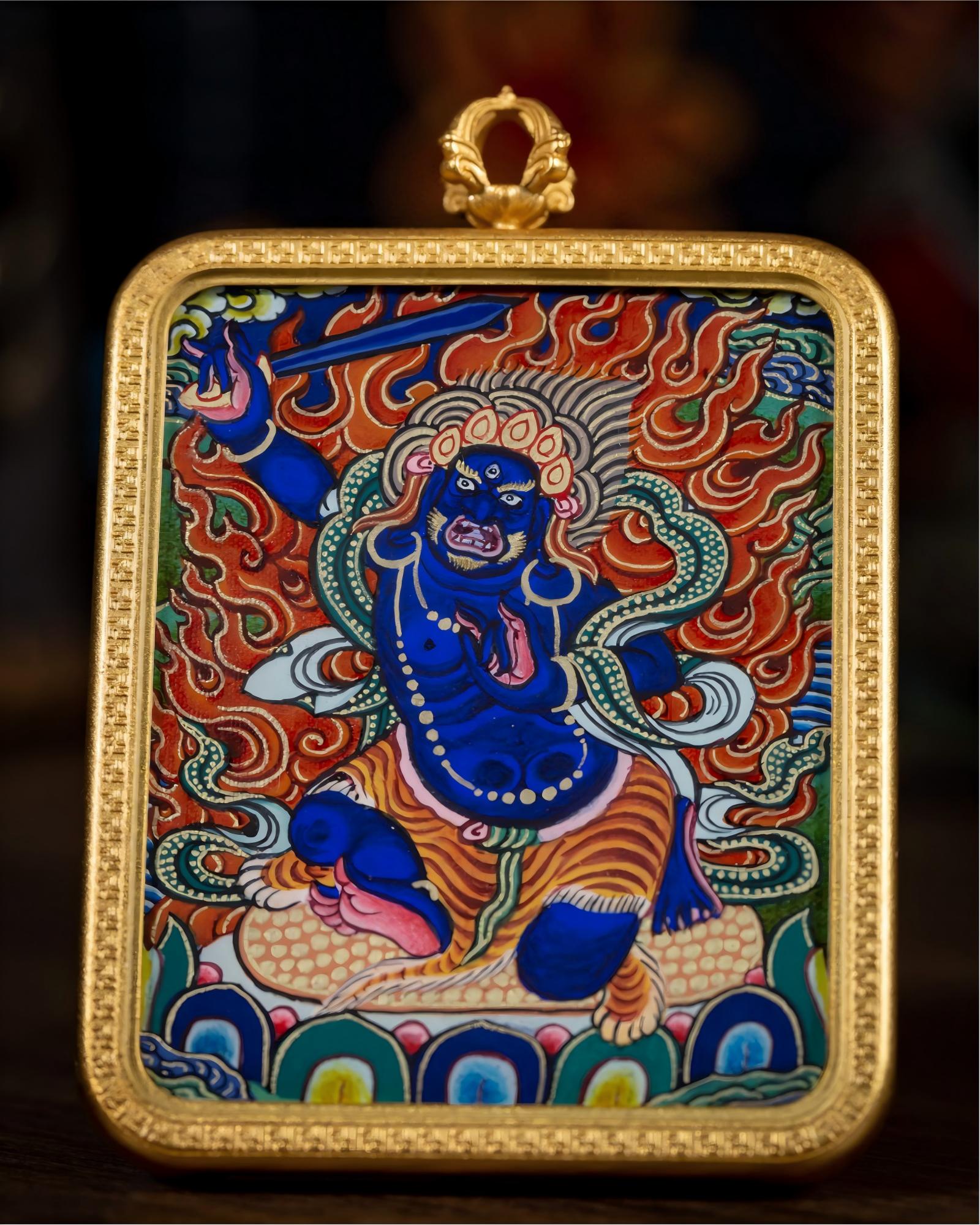 Front close-up of AURESTAR Acalanatha thangka pendant with painted Buddhist artwork.