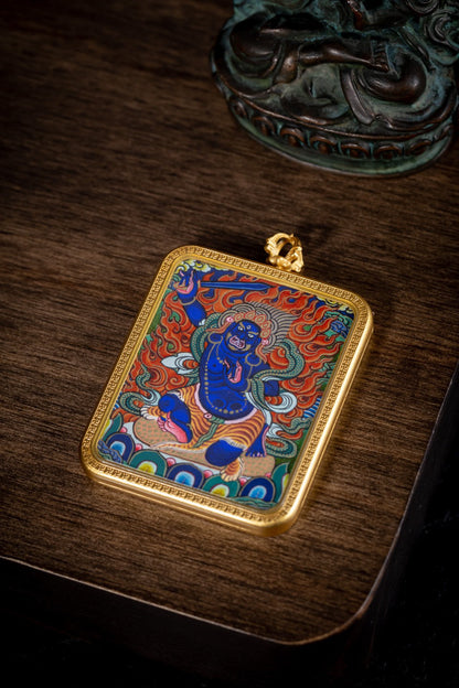 AURESTAR Acalanatha thangka pendant displayed flat on a wooden table.