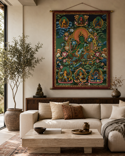 Green Tara thangka wall art displayed above a modern living room sofa.