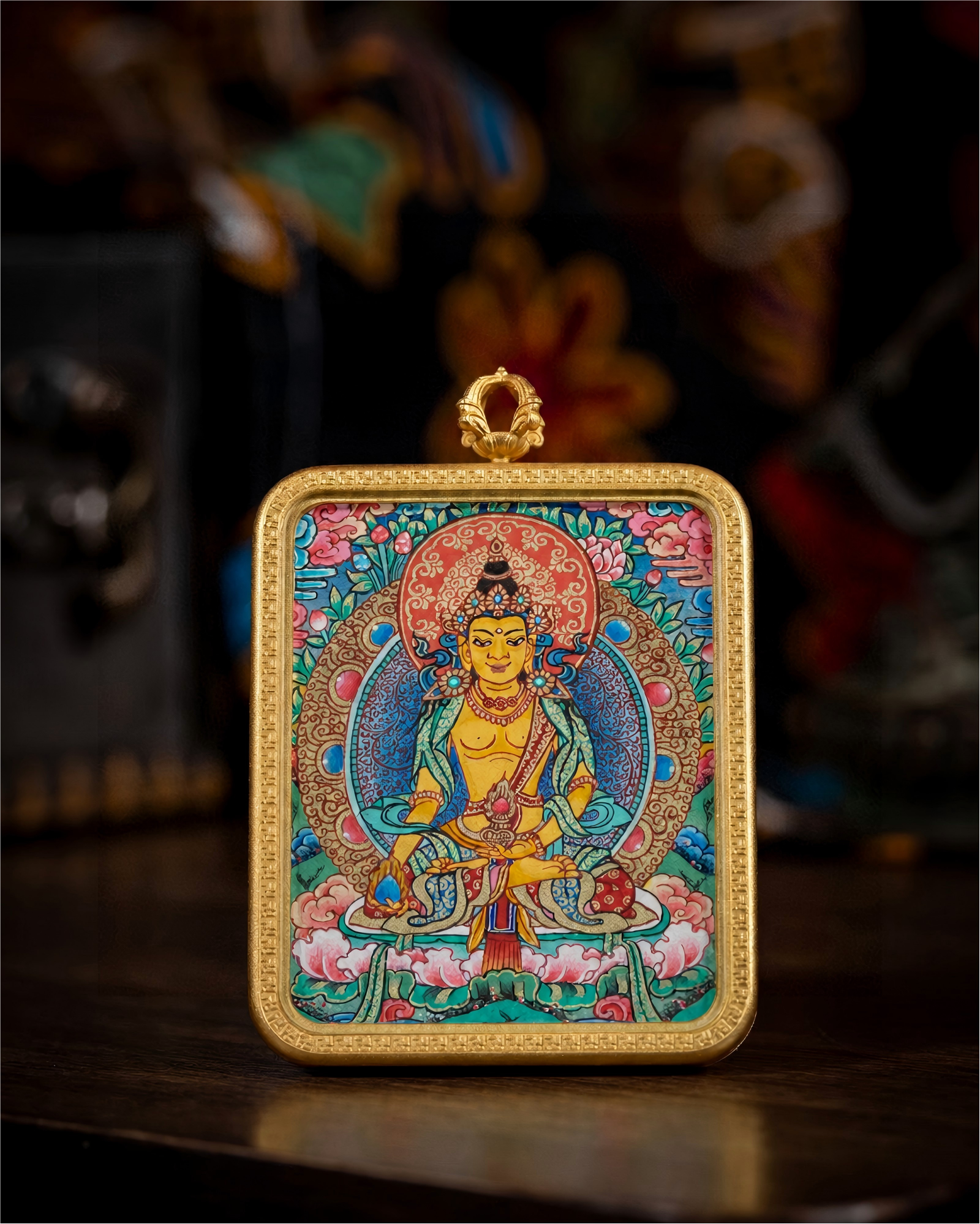 AURESTAR Ksitigarbha thangka pendant displayed upright on a wooden table.