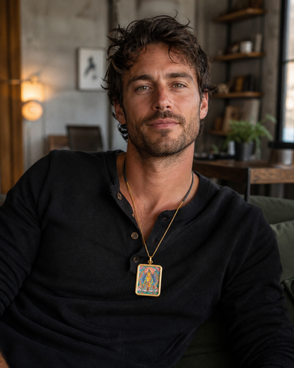 Man wearing an AURESTAR Ksitigarbha thangka pendant in a home setting.
