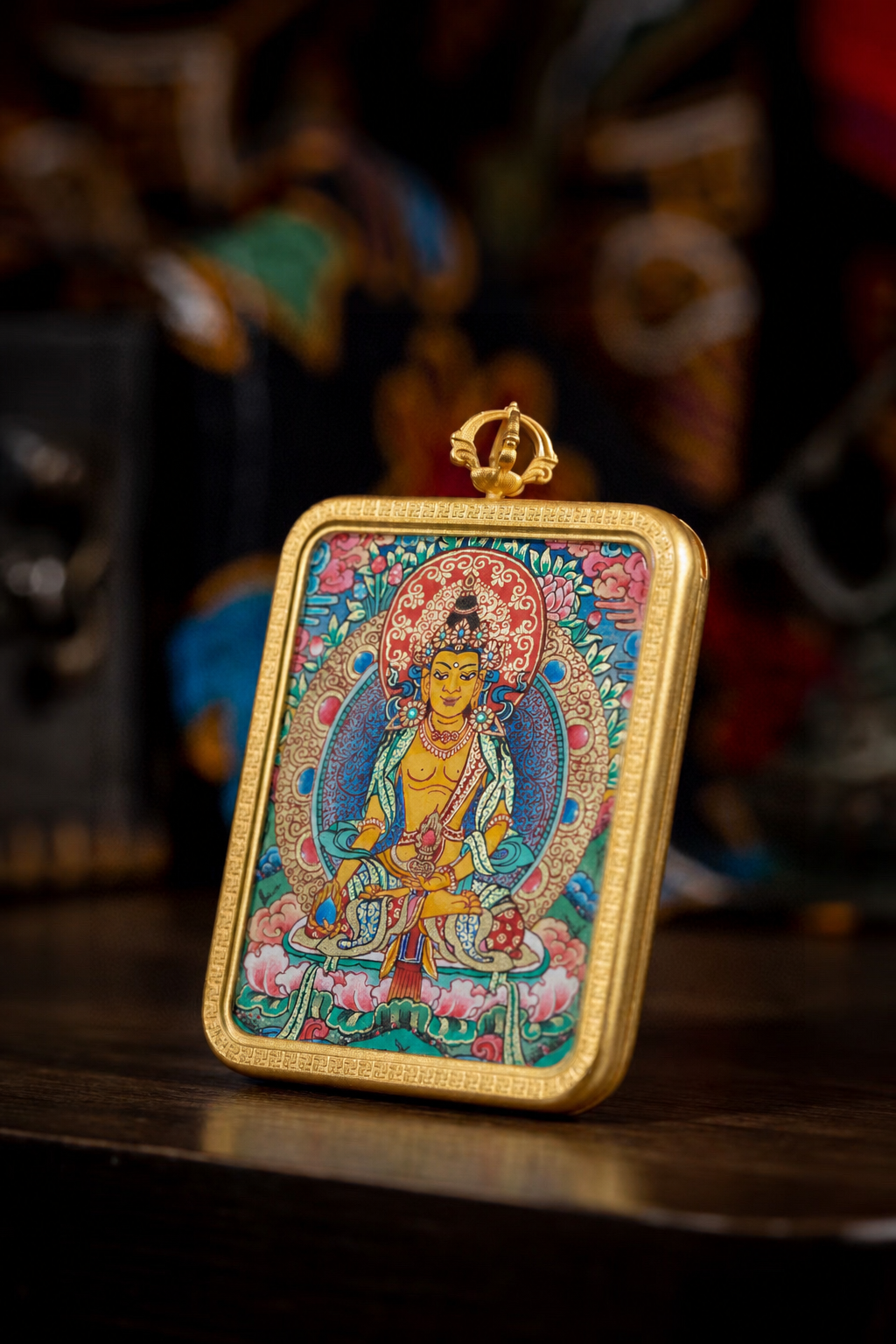 Side view of AURESTAR Ksitigarbha thangka pendant in a copper case.