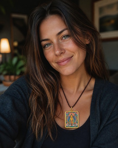 Woman wearing an AURESTAR Buddhist thangka pendant with a dark top.
