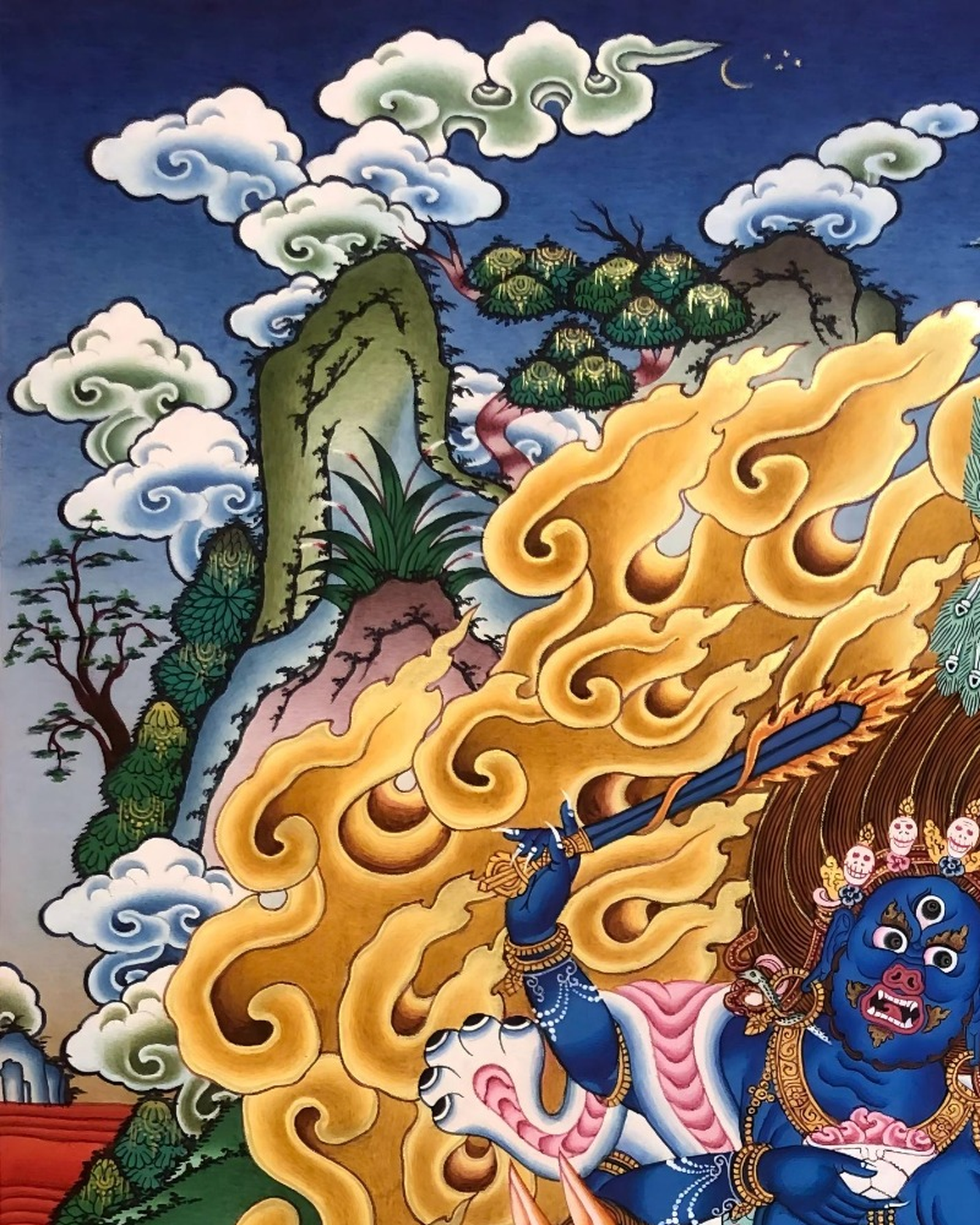 Left detail of Palden Lhamo thangka with mountains, clouds, and flames.