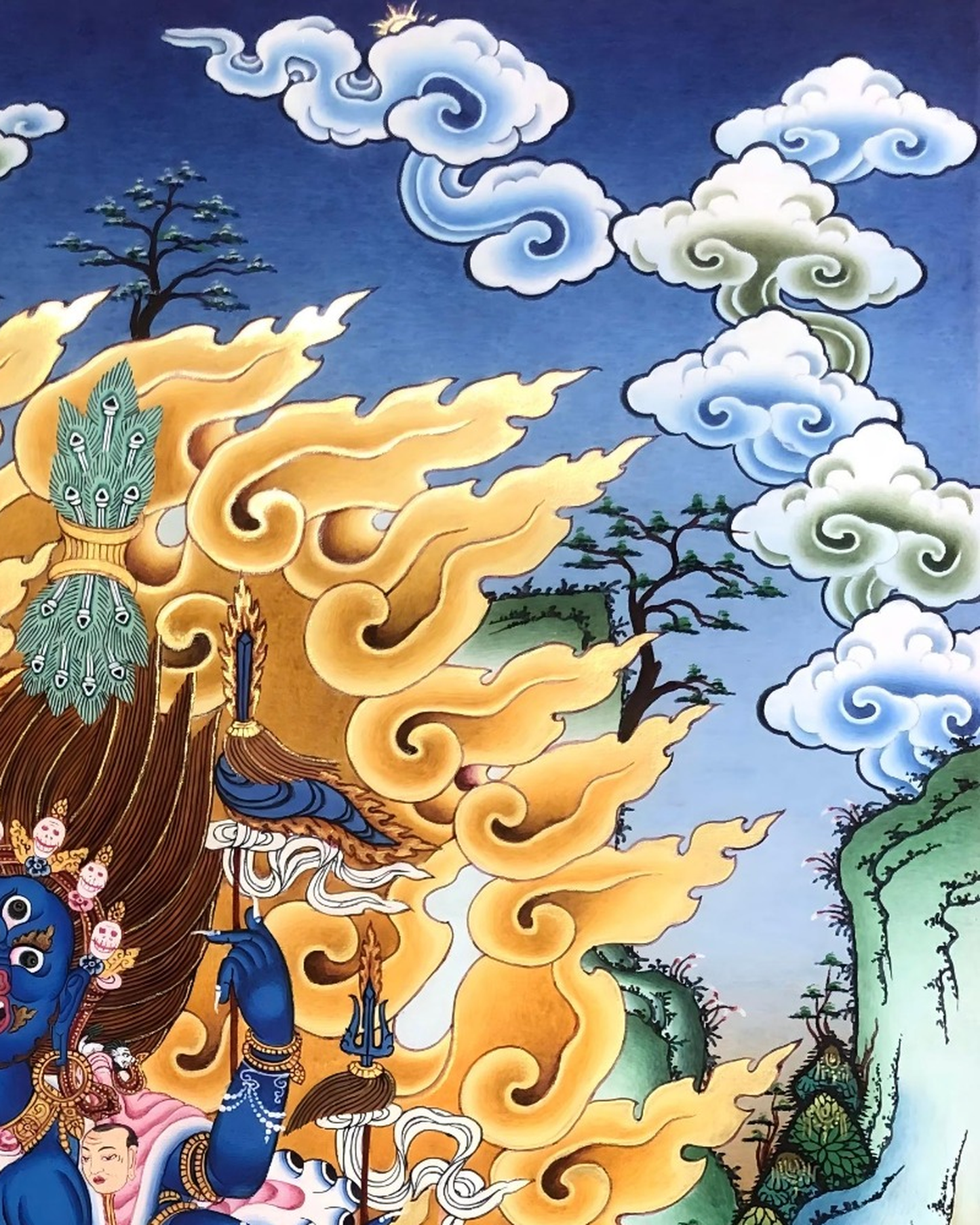 Right detail of Palden Lhamo thangka with clouds and golden flame patterns.