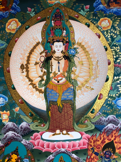 Close-up of Thousand-Armed Avalokiteshvara in a Tibetan thangka painting.
