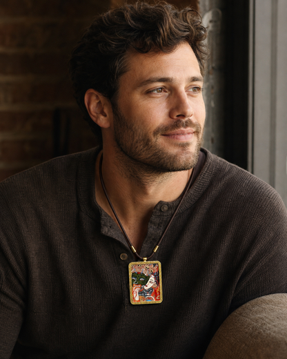 Man wearing an AURESTAR thangka pendant with a dark sweater.