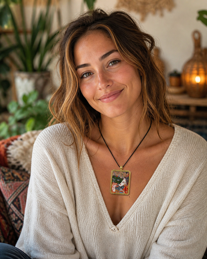Woman wearing an AURESTAR Zaki Lhamo pendant with a cream sweater.